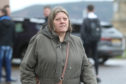 Alison Macdonald leaving Inverness Sheriff Court where she appeared on a charge of embezzlement.