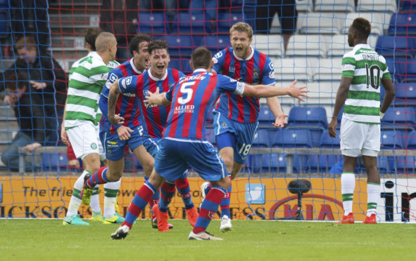 Alex Fisher runs to Gary Warren after his equaliser against Celtic in August 2016.