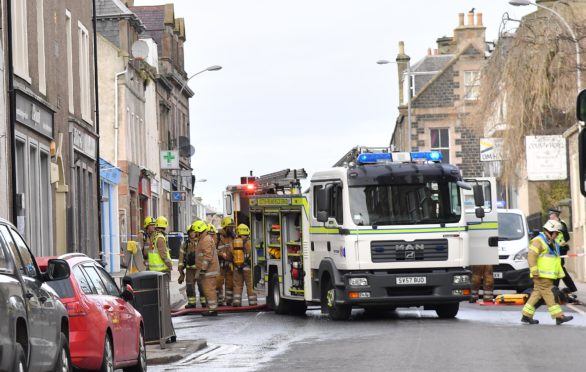 Emergency crews at the scene following a fire on High Street, Banff yesterday.