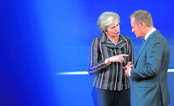 British Prime Minister Theresa May, left, speaks with European Council President Donald Tusk