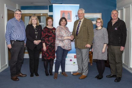 Representatives of Point and Sandwick Trust (PST) and Bethesda Care Home and Hospice after the PST handed over £30,000 to aid the running costs of the Hospice