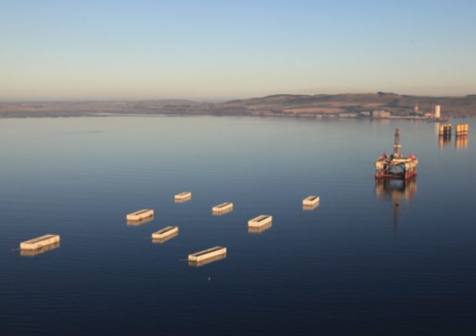 The first of the 22 concrete caissons has left Cromarty Firth on a 180-nautical mile journey to Aberdeen harbour.