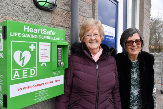 Catra vice chairwoman Rita Cartney and chairwoman Julie Pickering with the new defibrillator at Crimond Primary School.