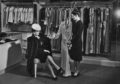 A woman dressed in a fur coat and feathered hat is shown a robe by a saleswoman in the lingerie department of a department store in the 1940's. (Photo by Welgos/Archive Photos/Getty Images)