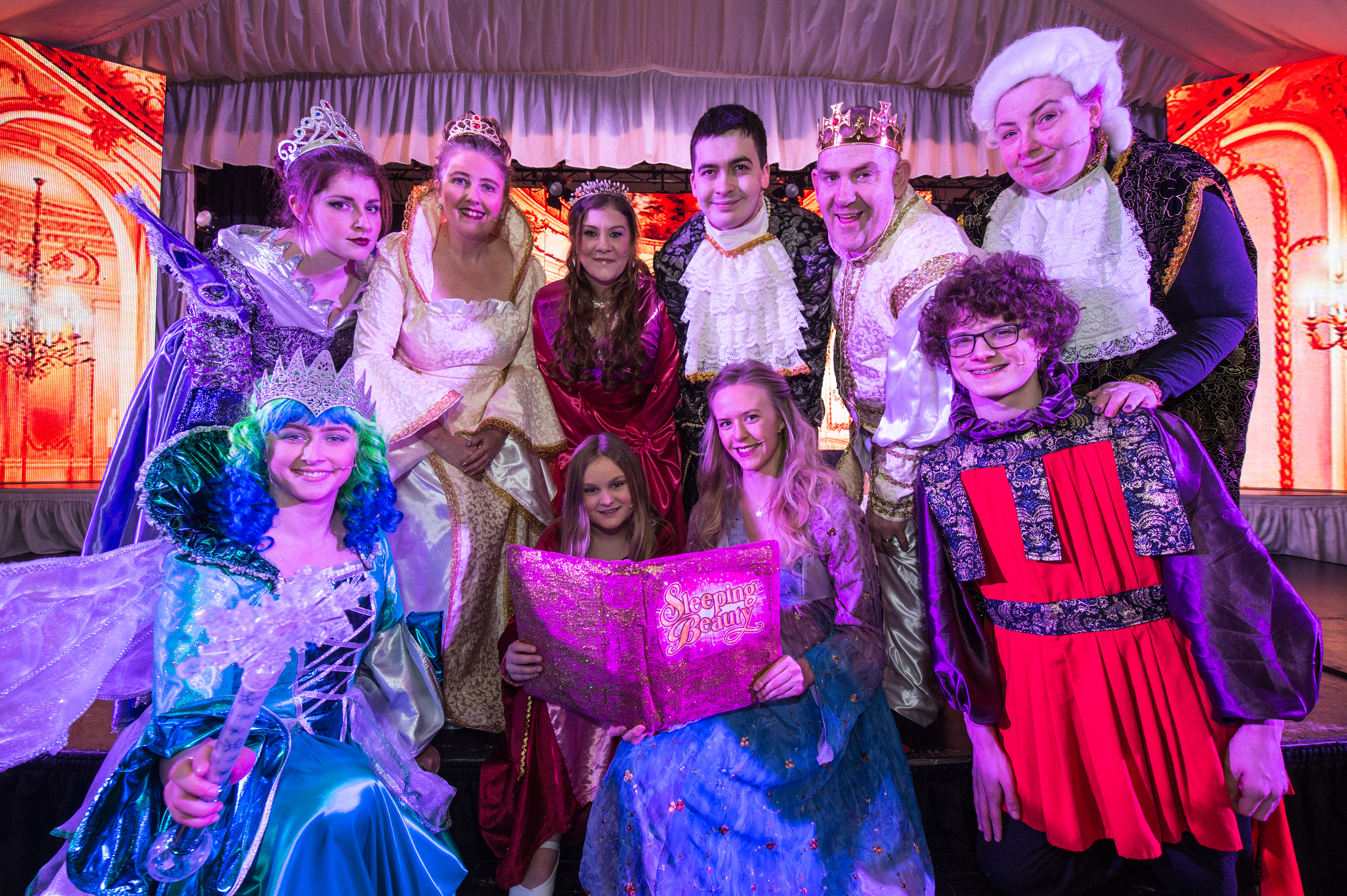 Danya Smith who plays Sleeping Beauty, back row third from left, with other members of the cast.