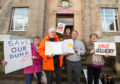 Picture by JASON HEDGES    

Buckie and Lennox town community councils hand over a petition to stop the closure of the Gallachy dump in Buckie, Moray.

Picture: