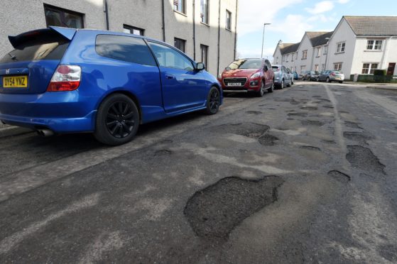 Dunabban Street in Invernes which is riddled with potholes.