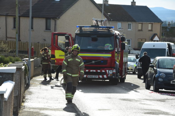 Firefighters at the scene in Lossiemouth. Picture by Jason Hedges.