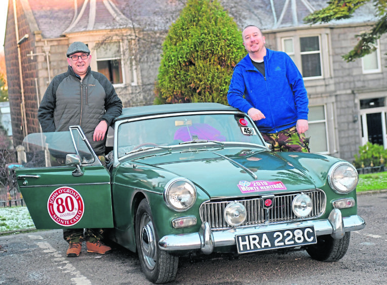 Colin Cane and Darren Stewart with their MG Midget 65. Picture by Kath Flannery.