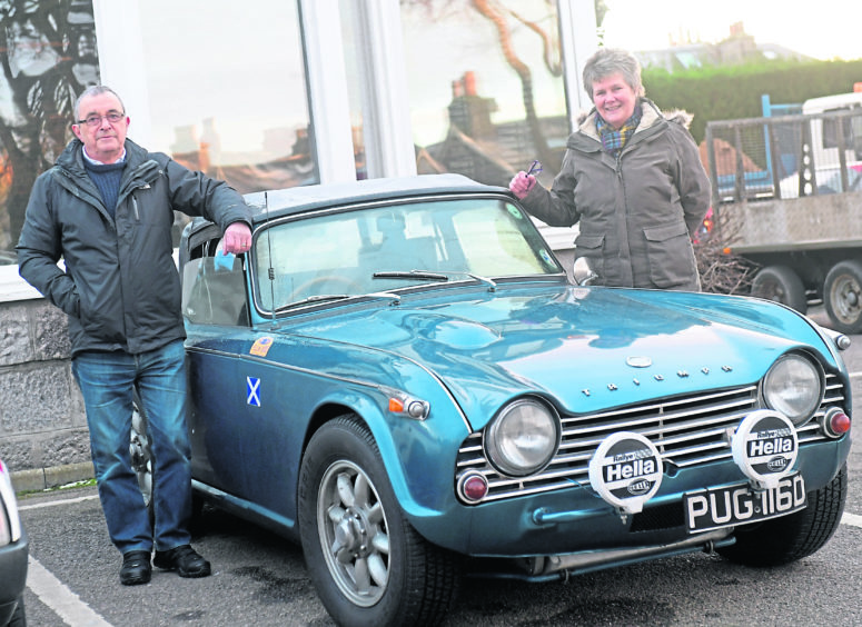 Bill and Val Pollock with their Triumph TR4A. Picture by Kath Flannery.