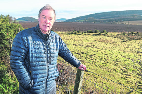 Black Isle councillor Gordon Adam at an area of land off the Allangrange road near Munlochy.