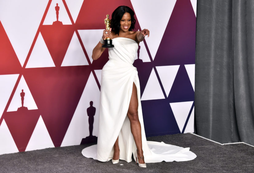 Regina King with her Best Supporting Actress Oscar for If Beale Street Could Talk.