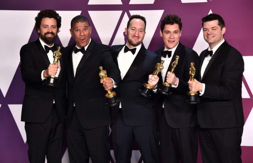 Bob Persichetti, Peter Ramsey, Rodney Rothman, Phil Lord, and Christopher Miller with their Oscars for Best Animated Feature Film for Spider-Man: Into The Spider-Verse.
