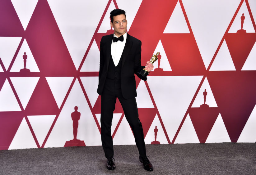 Rami Malek with his Best Actor award for his performance as Freddie Mercury in Bohemian Rhapsody.
