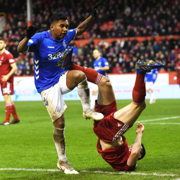 Alfredo Morelos and Scott McKenna tangle.