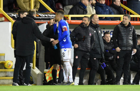 Aberdeen assistant manager Tony Docherty (right) exchanges words with Rangers boss Steven Gerrard.