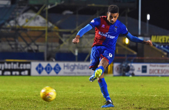 Nathan Austin rolls home the decisive penalty against Ross County in 2019.