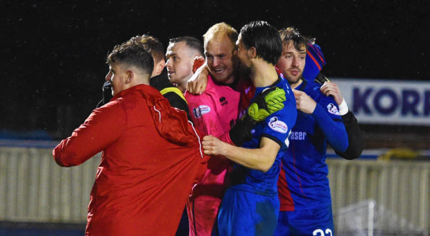 Mark Ridgers is mobbed after Caley Thistle's shootout win in the Scottish Cup.