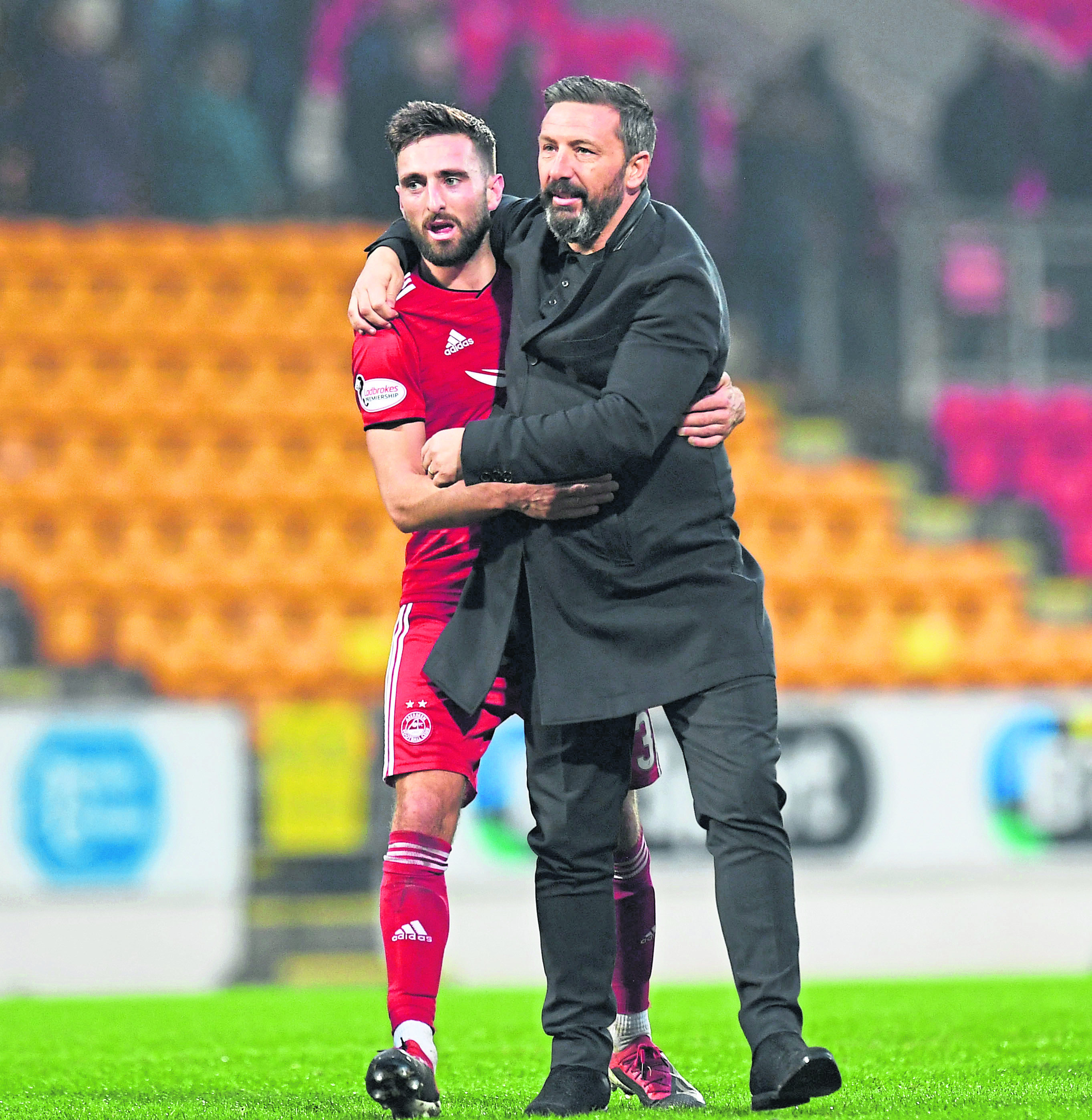 Aberdeen's Graeme Shinnie (L) celebrates at full time with manager Derek McInnes.