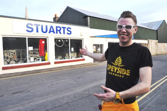 Seb Jones outside Stuarts Cycle Shop