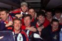 The Inverness players celebrate their victory with manage Steve Paterson on the team bus.