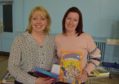 Left to right: SHaron Hall from Dyslexia Routes showing mum Rachael Smith some resources which can help those with dyslexia