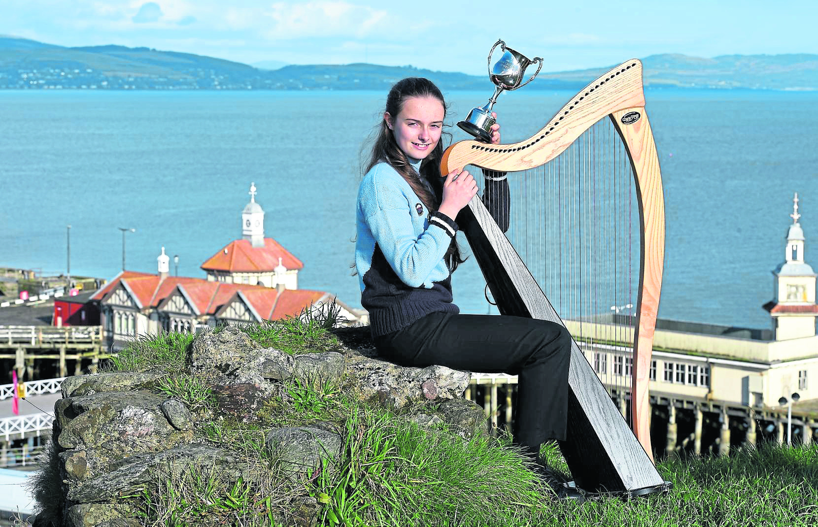 Clarsach winner Meredith Kennedy (12) of Stirling with the Duncan Chisholm Trophy for Clarsach playing photographed above Dunoon in 2018.
Picture by Sandy McCook.