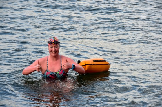 Jennifer Laffan, who is training to cross the Channel in aid of the RNLI, pictured after a 1.1mile swim in Macduff