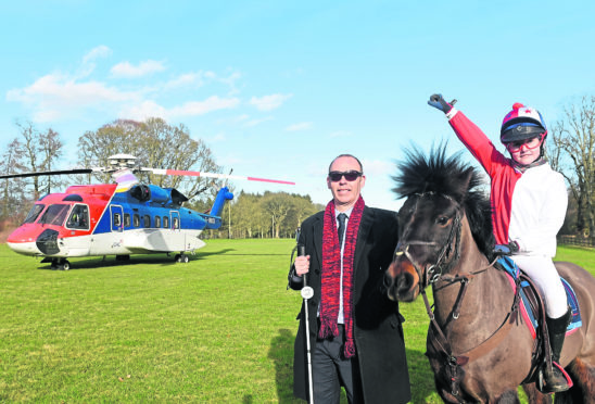 Pictured are Graham Findlay (NESS) and Millie Walker riding her pony - Cosmic Chaos at Fraser Castle. CHC is flying in a helicopter to Castle Fraser for its Day at the Races event to raise cash for North East Sensory Services (Ness).
Picture by Darrell Benns.