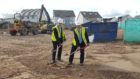 Richard Lochhead MSP and Mike Martin, chairman of Hanover Scotland, begin construction at the site of the former Spynie Hospital in Elgin.