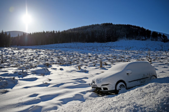 A car abandoned on the  A939 road between Cockbridge and Tomintoul. (Photo by Jeff J Mitchell/Getty Images)