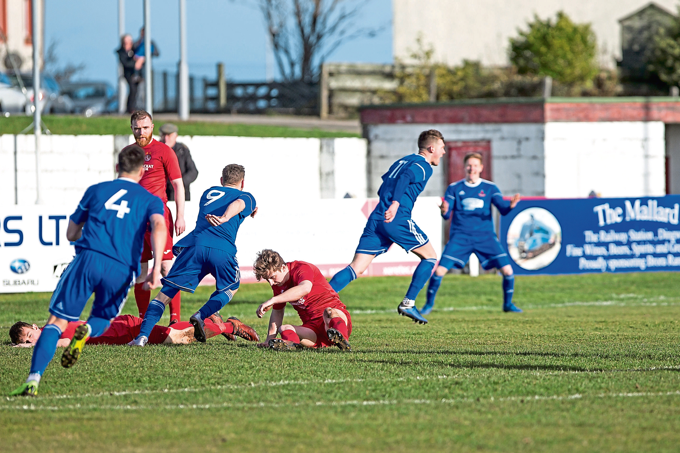 Cove's Jamie Masson's celebrate as he slots home the equaliser