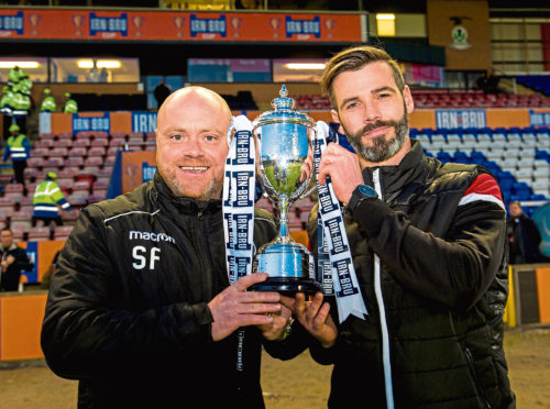 Ross County co-managers Steven Ferguson (L) and Stuart Kettlewell lift the trophy at full-time