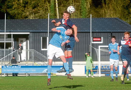 Turriff United (Navy) v Nairn (light blue)
Highland League
Pictured are Nairn's Cohen Ramsay and Turriff's Angus Grant.
Picture by DARRELL BENNS