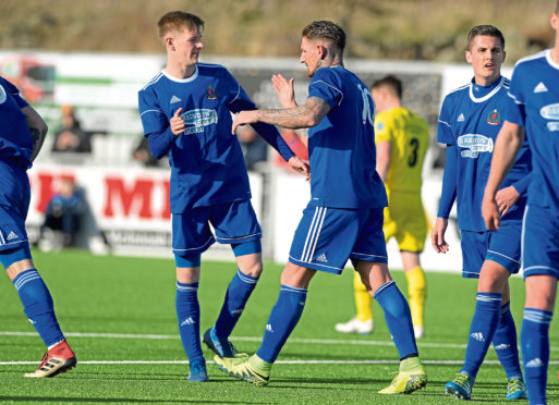 Cove's Martin Scott scores.