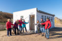 Cullen volunteers are the grand re-opening of their toilets