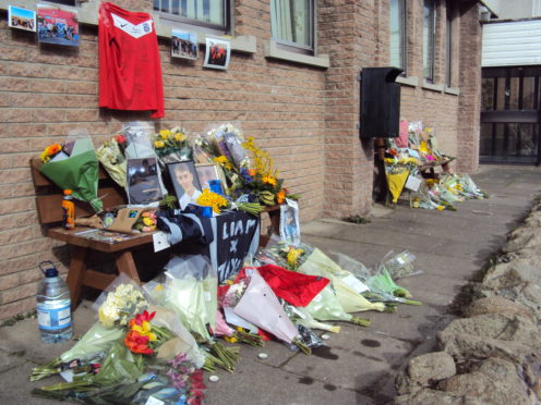 Flowers were piled up in tribute to Liam Smith.