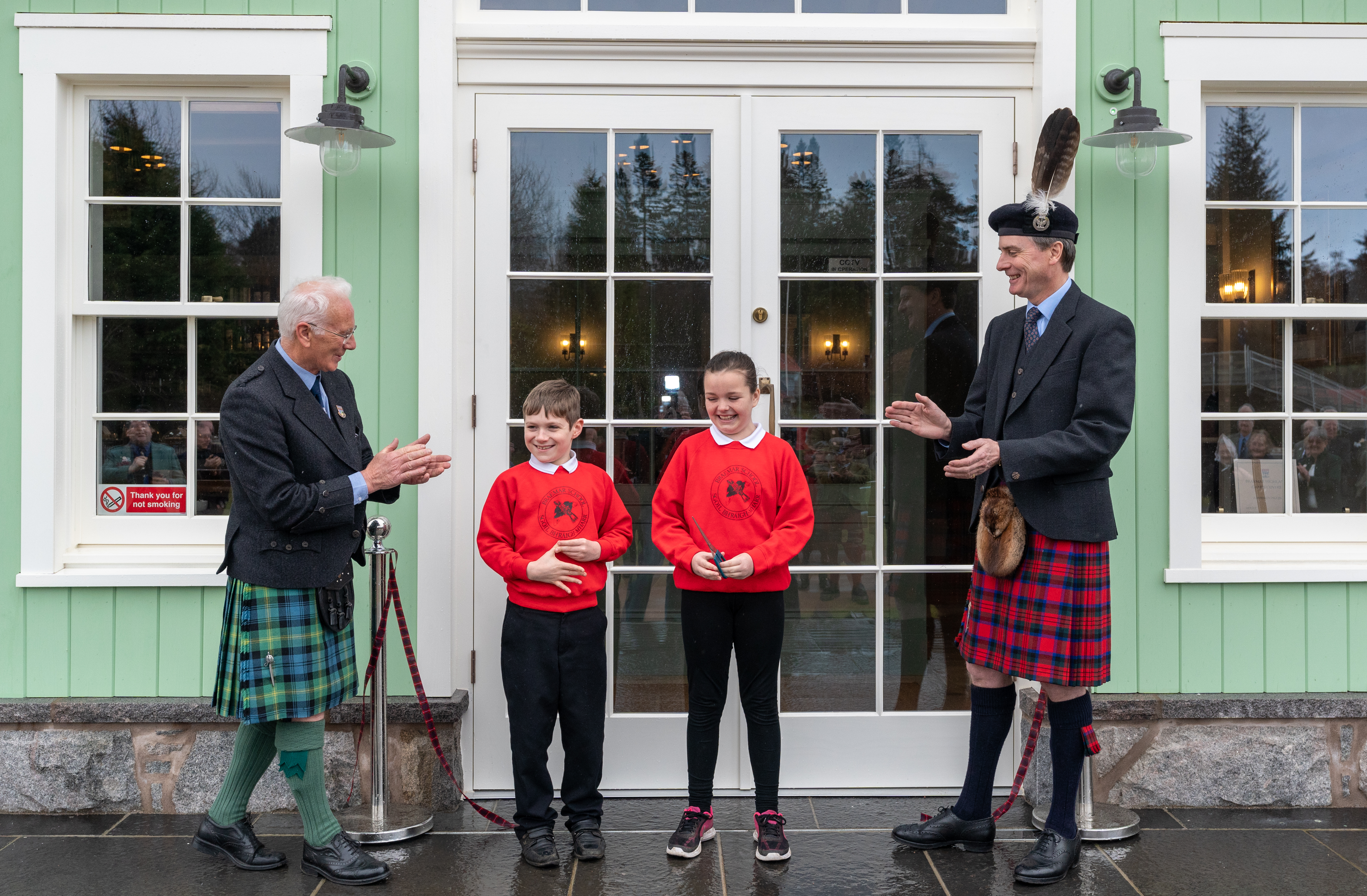 L-R: President of the Games, David Geddes, Lewis Mutch and Diamond Mackay of Braemar School and the Duke of Fife