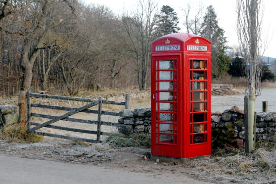 The telephone box now being used as a library which marks one of the diversion routes on the B976.