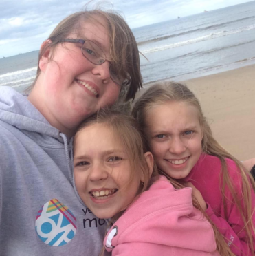 Emily Burns with Vika and Alina, who she hosted in Moray from Belarus.