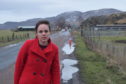 Kate Forbes MSP at the stricken road surface near to Laggan