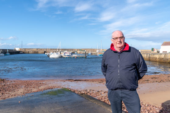 Dennis Slater, Chairman of Hopeman Community Association at Hopeman Harbour