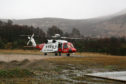 The coastguard search and rescue helicopter is also on scene helping with the rescue efforts.