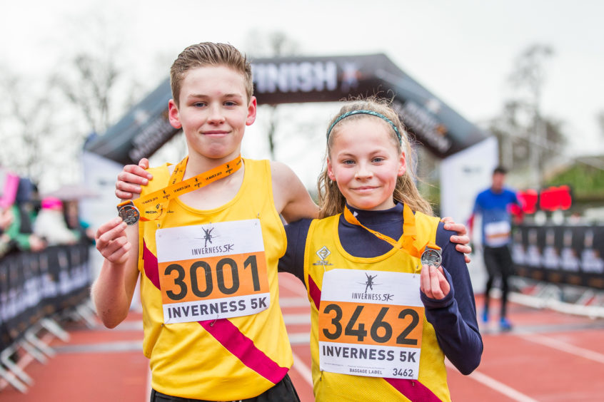 Brother and sister Lucas and Anna Cairns win the Inverness 5K.