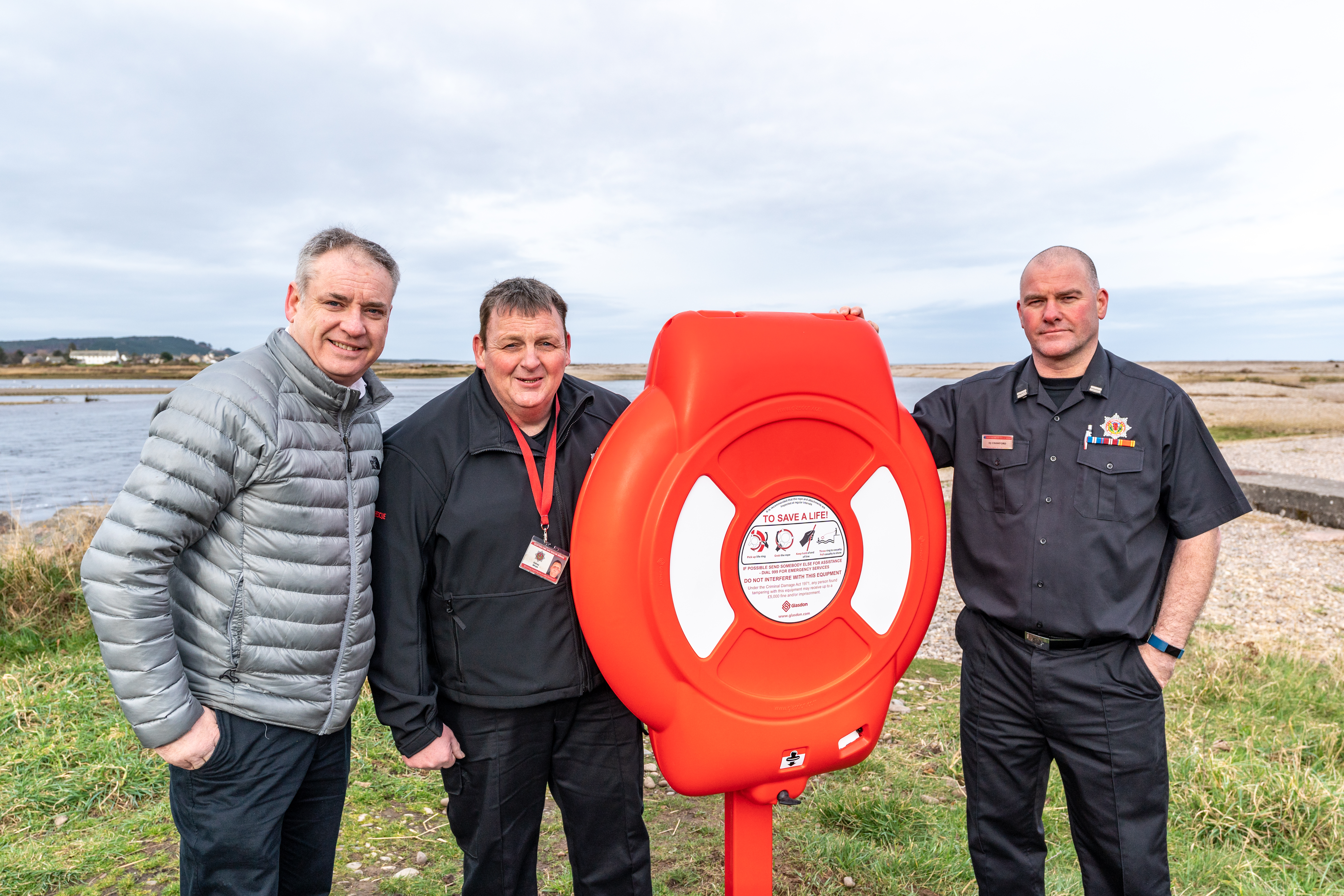 New lifesaving rings are installed at the mouth of the River Spey at Spey Bay following a joint project by fire station in Fochabers and Coastguard. (L-R) MSP Richard Lochhead, firefighter Sid Whyte and crew manager Dave Crawford of Fochabers Fire Station.