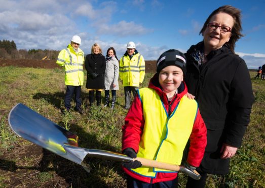 The turf has been cut to start construction on Linkwood Primary School in Elgin. Pictured front: P3 pupils James Kennedy with Sonya Warren, chairwoman of Moray Council's children and young people's committee. Pictured rear: chief executive of Hub North Scotland Michael Padzinski, Moray Council's Head of Schools Vivienne Cross, head teacher Fiona Stevenson, Balfour Beatty's contracts manager Joe Mulligan.