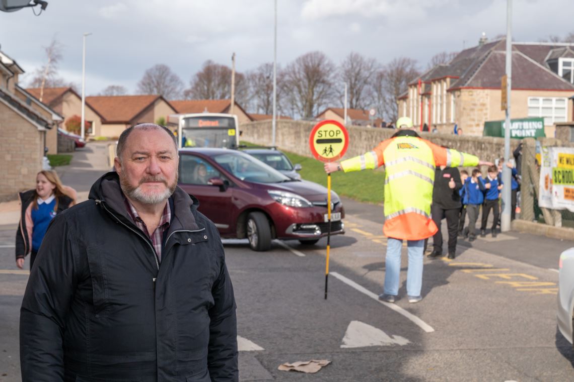Elgin City South councillor John Divers outside New Elgin Primary School.