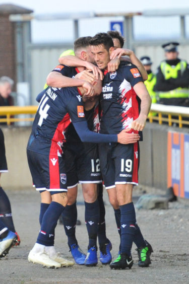 Number 14 Ross County's Josh Mullin scores