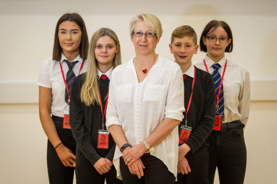 Picture by JASON HEDGES 

Author Nicola Morgan visits Elgin Academy as part of Moray Minds mental health campaign for school pupils to pass on tips for relieving stress and anxiety   .

Picture: L2R - Frankie Byrne (3rd year Forres Academy),Jennifer Pettinger (3rd Year Elgin Academy), Author Nicola Morgan, Josh Hanover (3rd Year Elgin Academy) and Elise Comley (3rd Year Lossiemouth High)