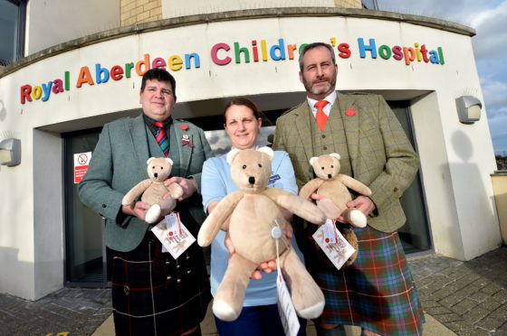 Ballater pipers and heavies have teamed up to donate cuddly toys to sick children.